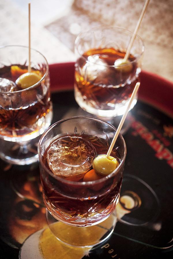 Vermouth With Ice Cubes And Olive Skewers Photograph by Malgorzata Stepien