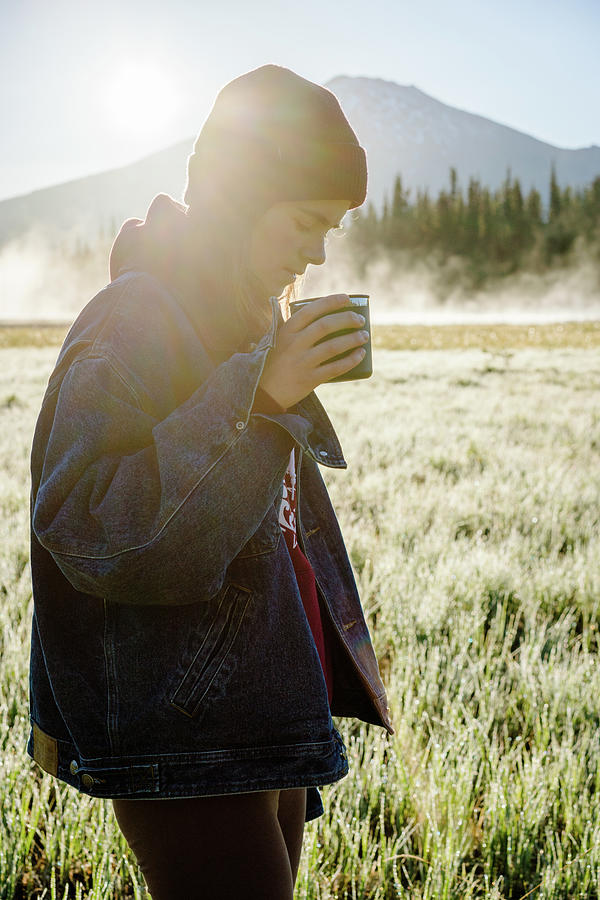 Vertical Image Of Young Woman Holding Reusable Cup At Sunrise Photograph by Cavan Images Vertical Image Of Young Woman Holding Reusable Cup At Sunrise Photograph by Cavan Images