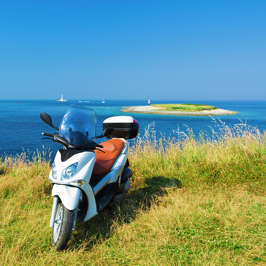 Vespa Sitting In Front Of An Ocean With Photograph by Gaspr13