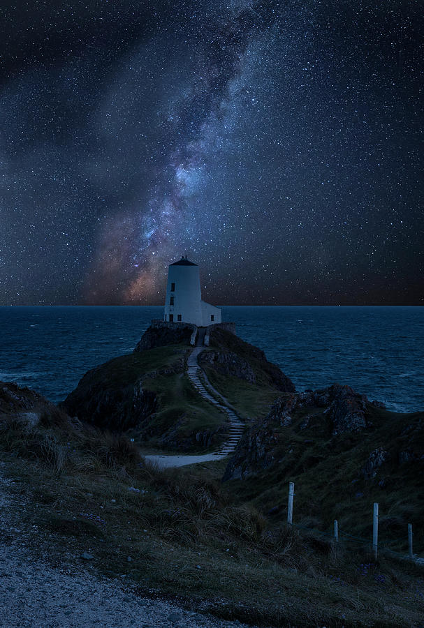 Spring Photograph - Vibrant Milky Way composite image over landscape of lighthouse o by Matthew Gibson