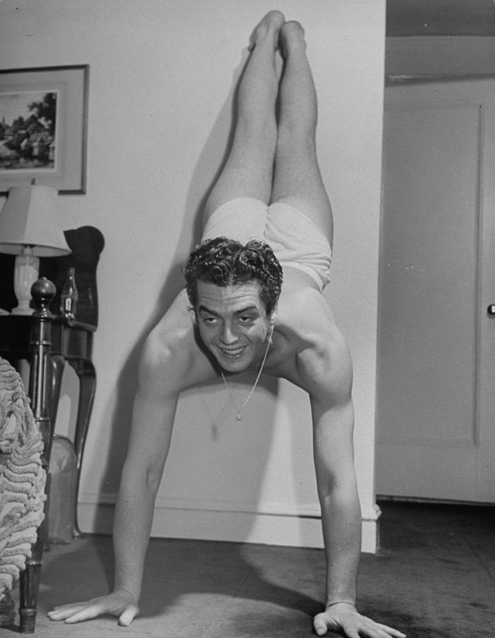 Black And White Photograph - Victor Mature Exercising by Alfred Eisenstaedt
