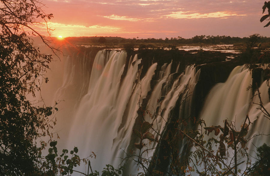 Victoria Falls With Sun On Horizon Photograph by Denny Allen