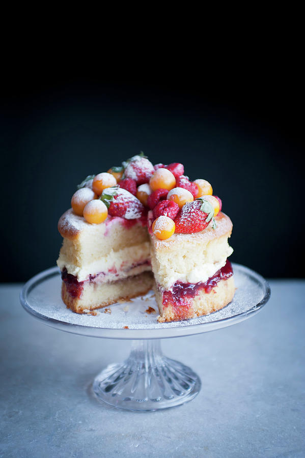 Victoria Sponge With Stawberries And Frosted Fruit Photograph by William Reavell