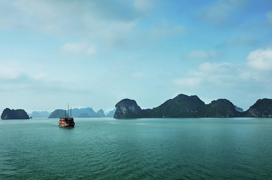 Vietnamese Junk Cruising In Halong Bay Photograph by Photo By Sayid Budhi