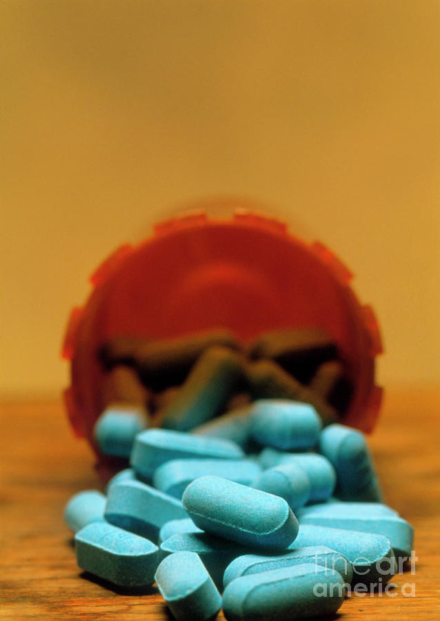 View Of Blue Pills Spilling From A Pot Photograph by John Greim/science Photo Library