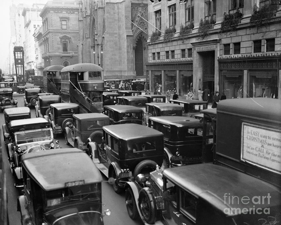 View Of Buses And Cars In Traffic Photograph by Bettmann