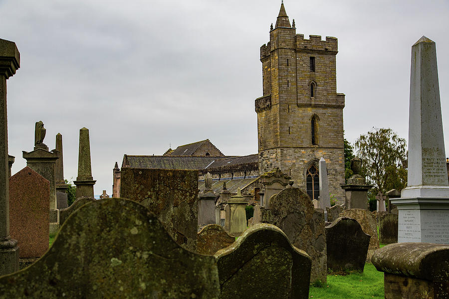 Architecture Photograph - View Of Cemetery From Tombstones And Gothic Church Tower by Cavan Images