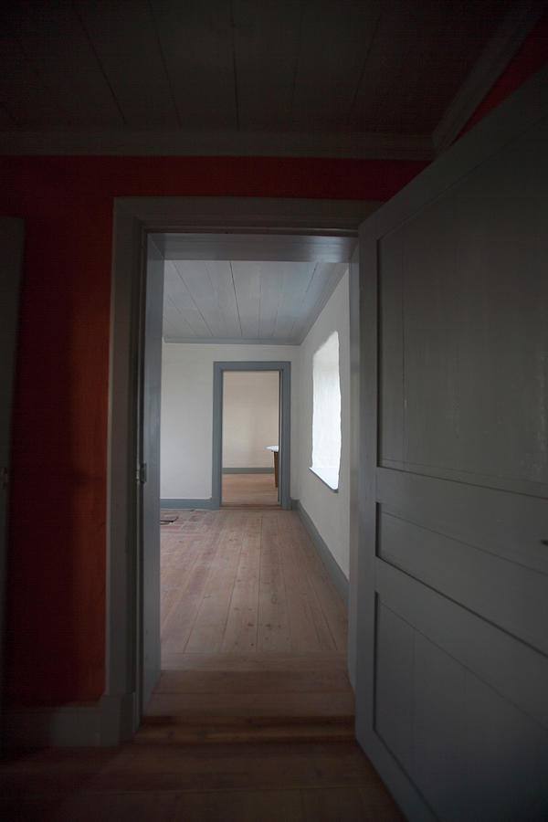 View Of Empty Room Through Door Photograph by Johner Images