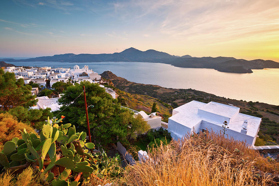 Greek Photograph - View Of Milos Bay And Plaka Village, The Capital Of Milos Island. by Cavan Images