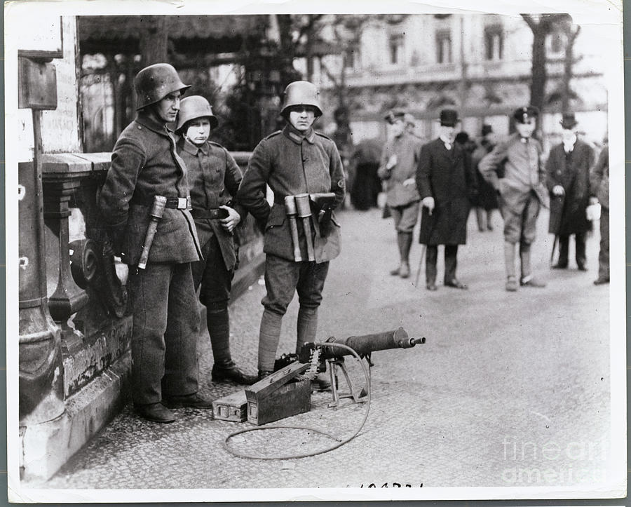 View Of Soldiers Standing In Street by Bettmann