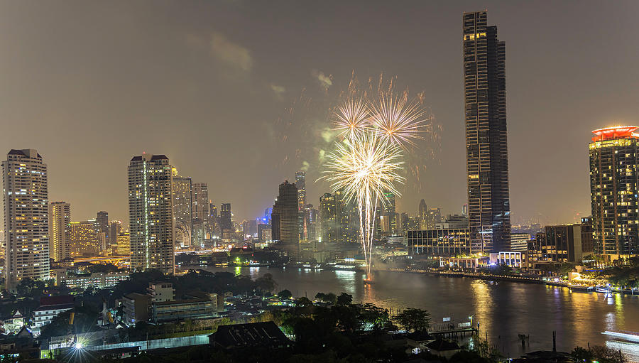 View Of The Chao Phraya River And Skyline With Fireworks, View From Supalai River Place At Night, Bangkok, Thailand Photograph by Robin Runck