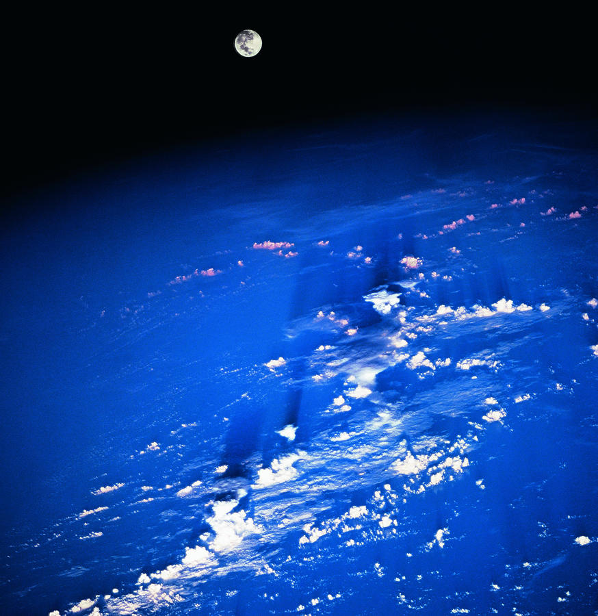 View Of The Moon Above The Earth Photograph by Stockbyte