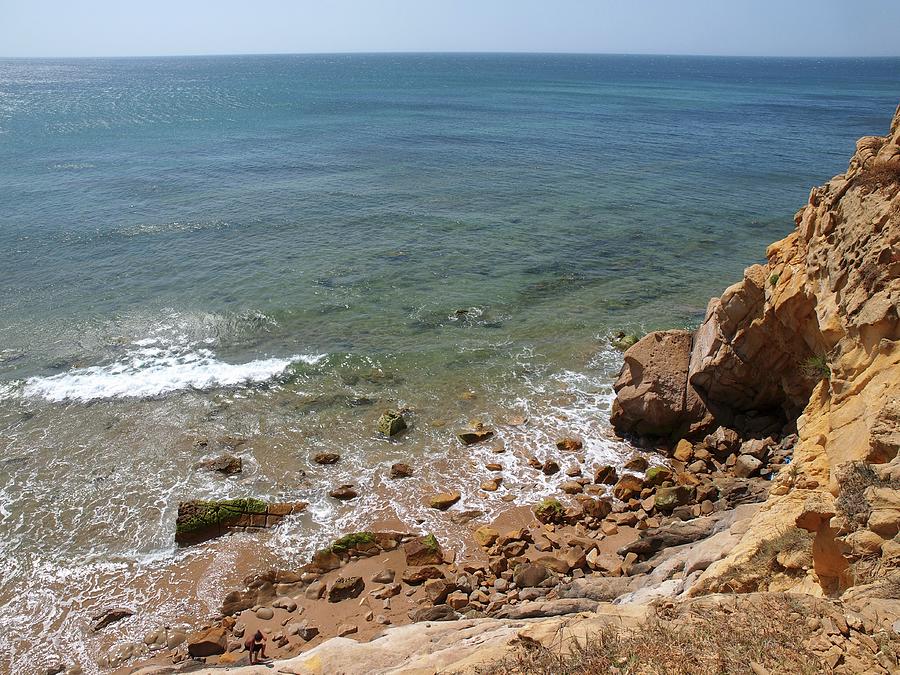 View Of The Rocky Paradise Beach In Asilah, Morocco Photograph by Jalag / Marion Beckhuser
