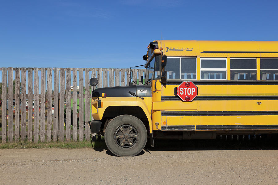 View Of Yellow School Bus At Watrous Town On Highway 2, Saskatchewan, Canada Photograph by Jalag / Arthur F. Selbach