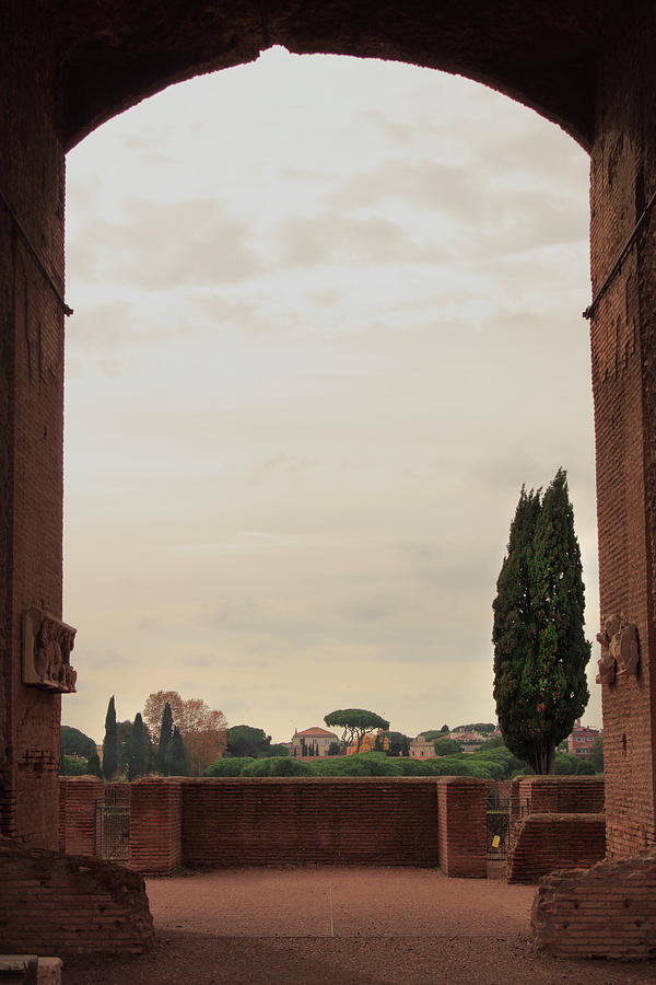 View through Archway of Domitians Palace on Palatine Hill at Sunset Photograph by Angela Rath