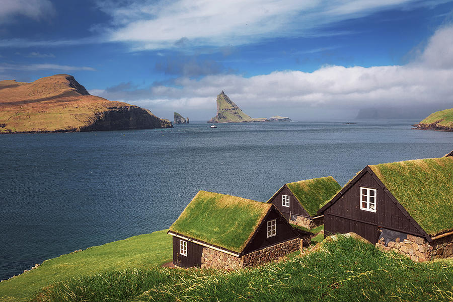 Village of Bour on Faroe Islands with Drangarnir sea stack in the ...