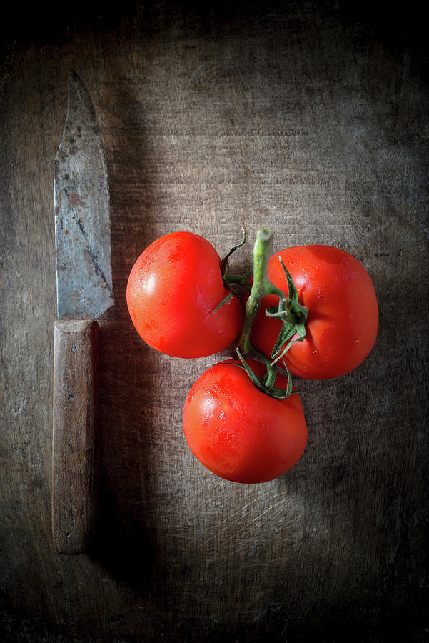 Vine Ripe Tomatoes On A Wooden Background Photograph by Nitin Kapoor