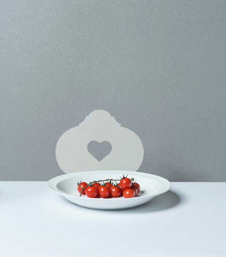 Vine Tomatoes On A Porcelain Plate Photograph by Angelika Grossmann