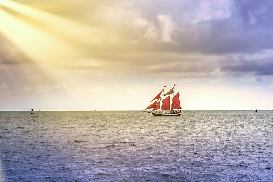 Vintage And Exotic Sailboat Sailing In South Florida Toward The Sun Rays Photograph