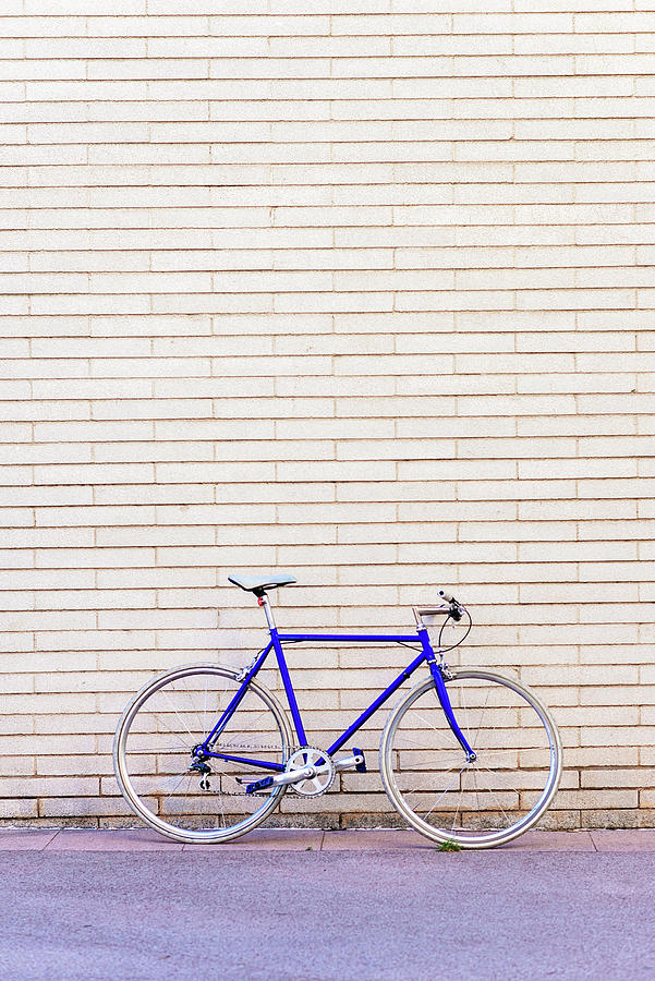 Vintage Blue Bike Leaning On A City Brick Wall Photograph by Cavan ...
