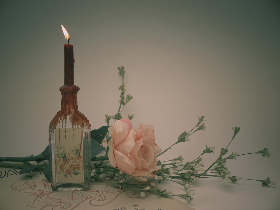 Vintage Candle With Rose Photograph by Copyright Dan Smith
