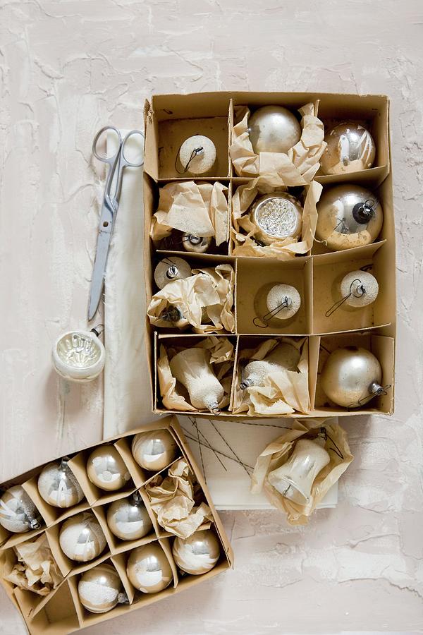 Vintage Christmas-tree Baubles In Old Cardboard Box Photograph by Alicja Koll