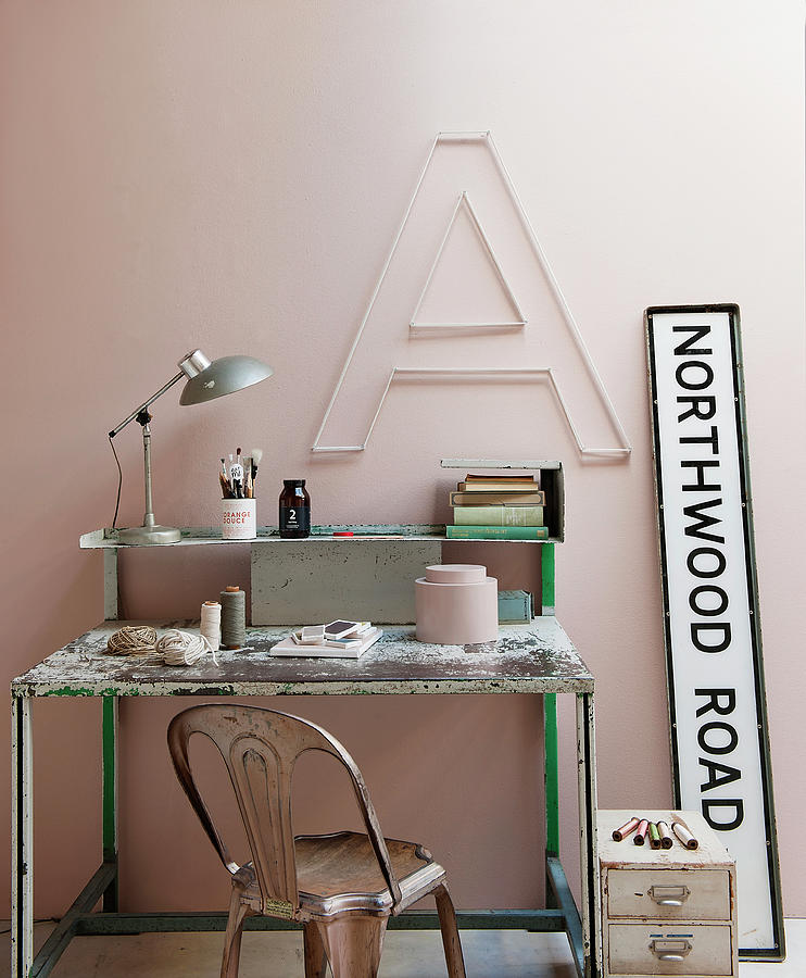 Vintage Desk And Chair Below Decorative Letter On Pink Wall Photograph by James Stokes