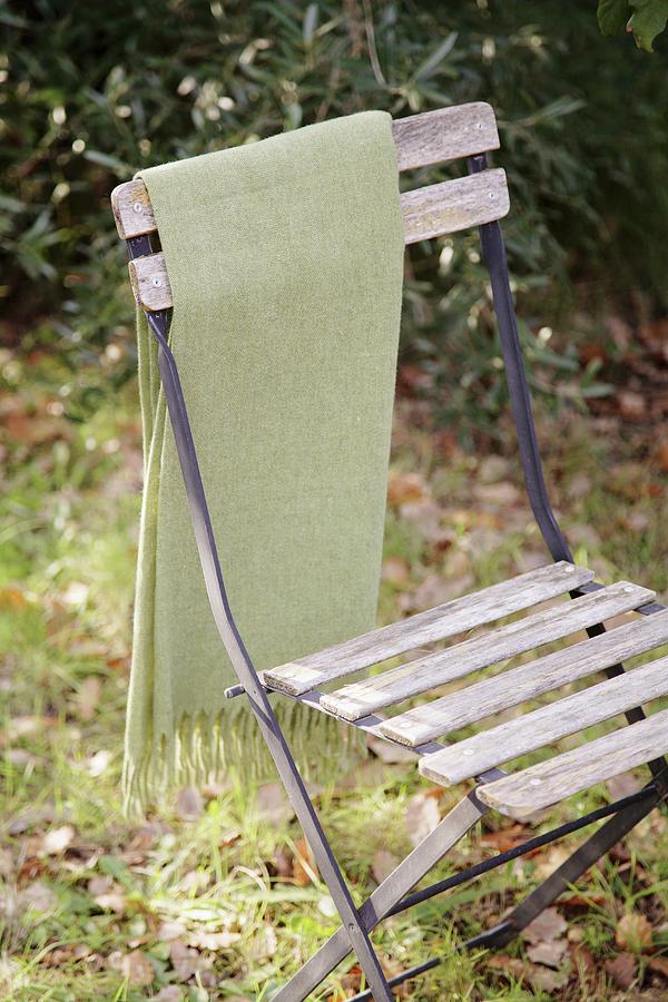 Vintage Garden Chair With Blanket Hanging On Back Photograph by Jos-luis Hausmann