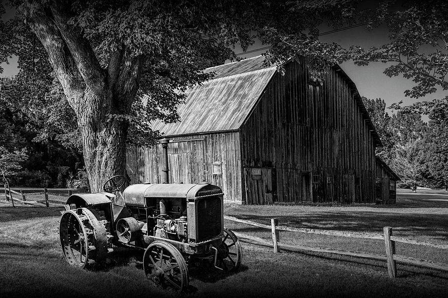 Vintage McCormick-Deering Tractor with old weathed Barn and Wood Photograph by Randall Nyhof