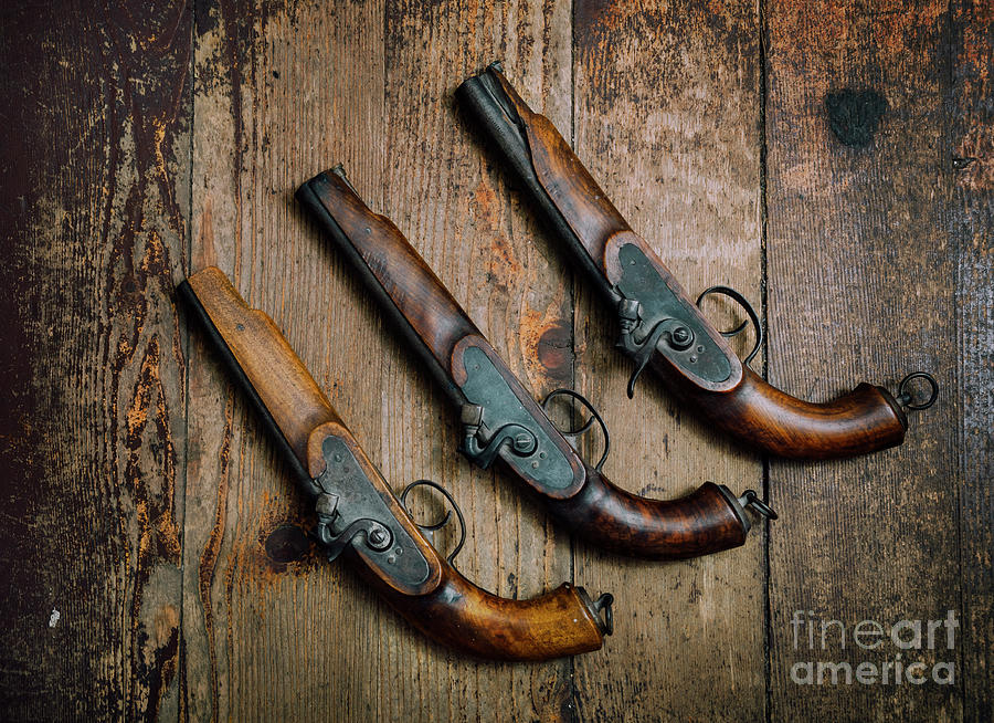 Vintage Pistols on Rustic wooden background Photograph by Jelena Jovanovic