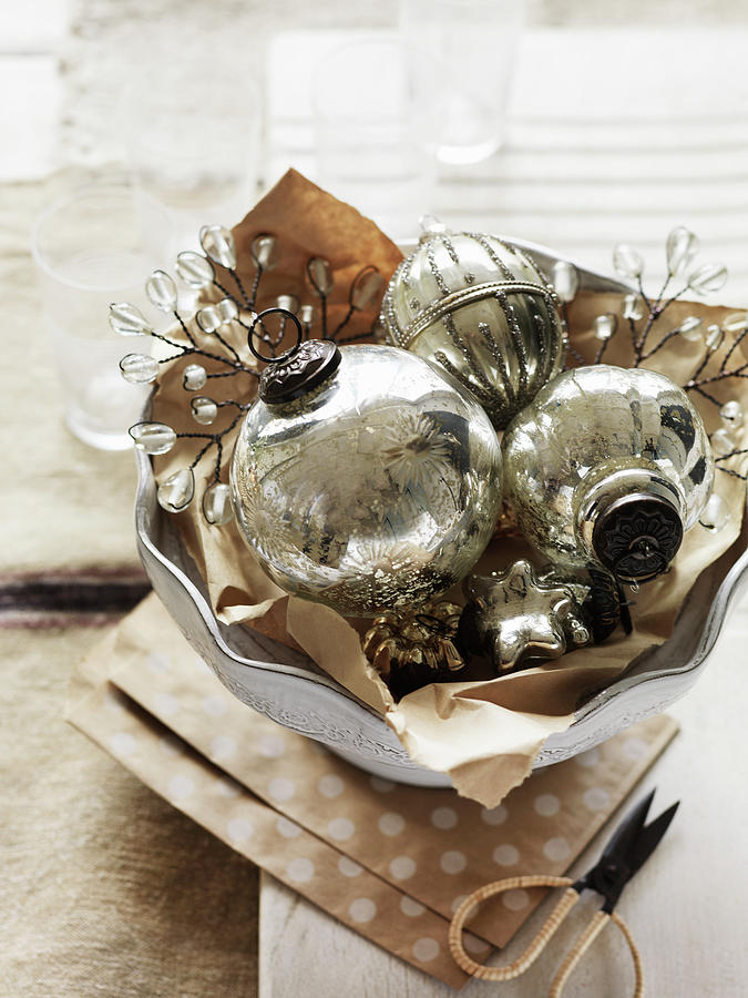 Vintage Silver Christmas-tree Baubles In Ceramic Bowl Photograph by Louise Lister