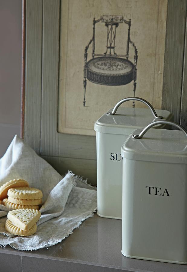 Vintage Storage Cans With Labels Next To Biscuits On Cloth Photograph by Jos-luis Hausmann