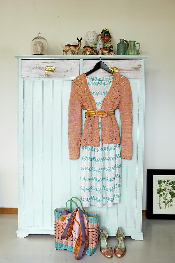 Vintage Wardrobe Painted Pale Blue Decorated With Vintage China Ornaments And Womans Clothing Photograph by Tine Guth Linse