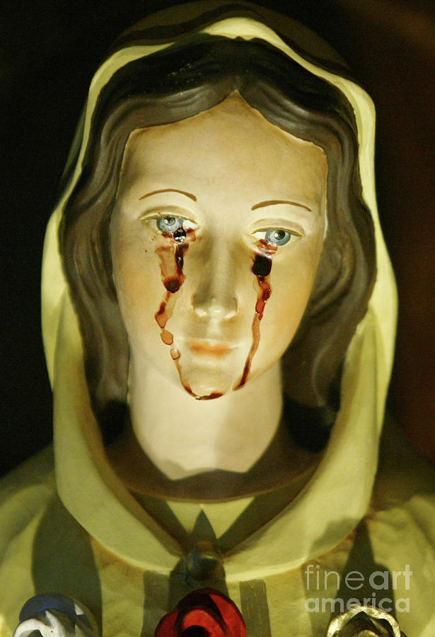 Virgin Mary Statue Said To Weep Tears Photograph by Getty Images