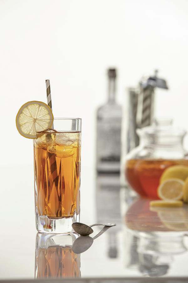 Vodka Ice Tea With Lemon Garnish And Striped Straw Photograph by Cindy Haigwood