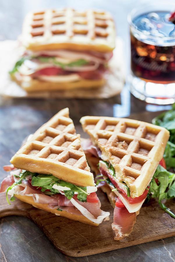 Waffle Sandwich With Ham, Tomato, Mozzarella And Rocket Photograph by Ltummy