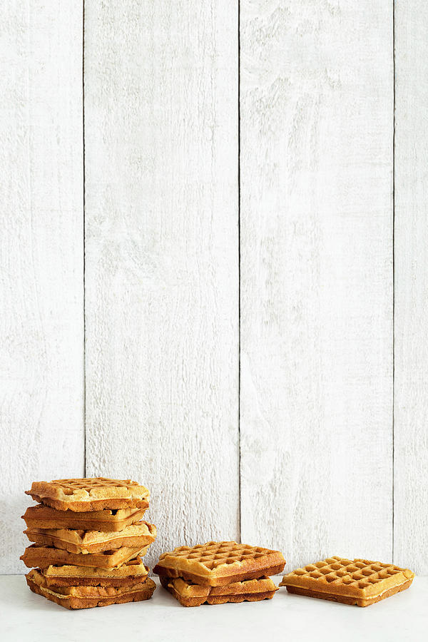 Waffles Against A Wooden Wall Photograph by The Food Union