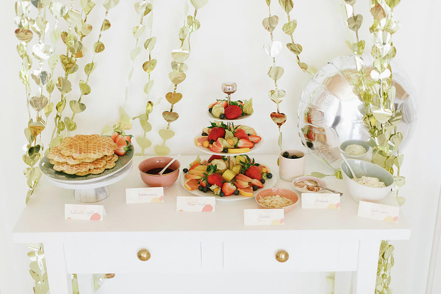 Waffles And Fruits On Party Buffet Table And Garlands Of Shiny Hearts Photograph by Katja Heil
