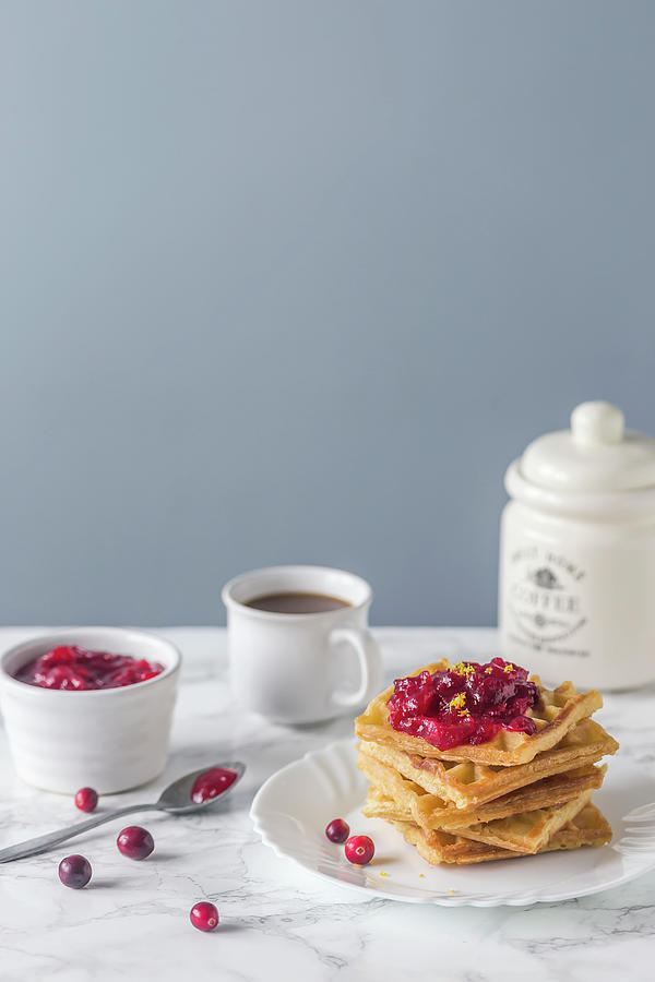 Waffles Served With Cranberry Sauce And Coffee Photograph by Malgorzata Laniak
