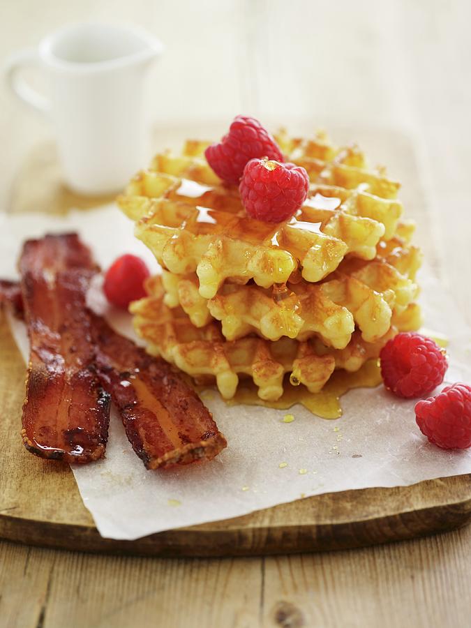 Waffles With Bacon, Maple Syrup And Raspberries Photograph by Amanda Stockley