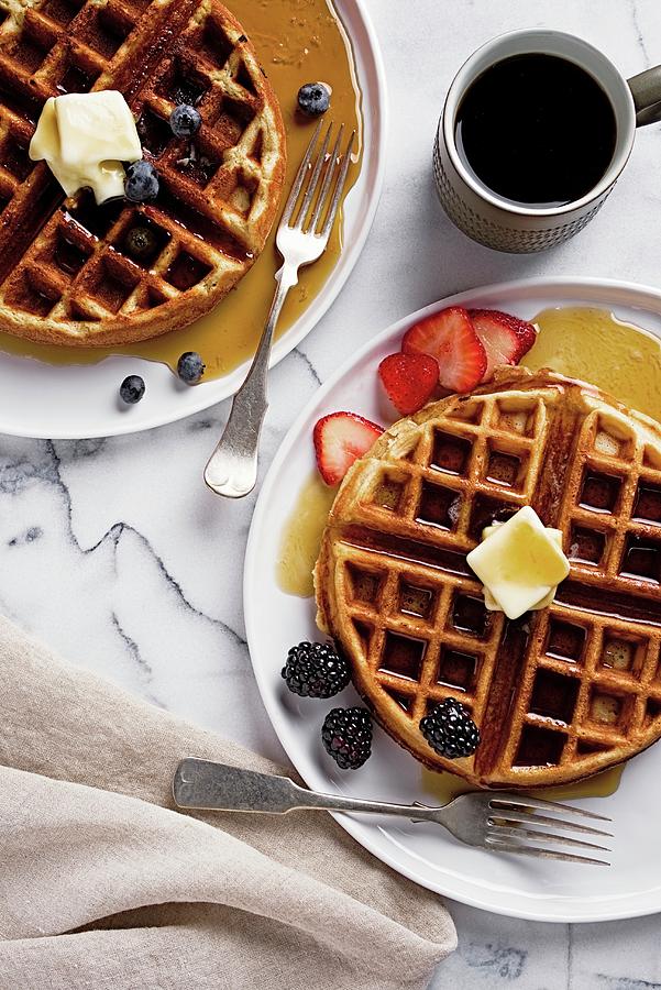 Waffles With Berries, Butter And Maple Syrup Served With Coffee seen From Above Photograph by Fred + Elliott  Photography