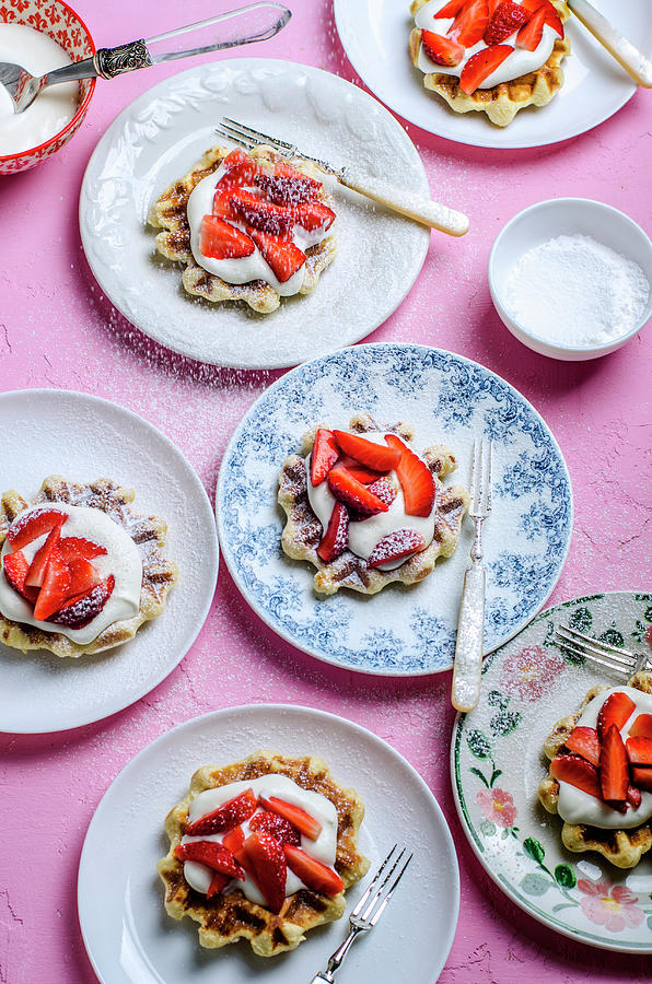 Waffles With Cream And Strawberries, Sprinkled With Powdered Sugar Photograph by Gorobina