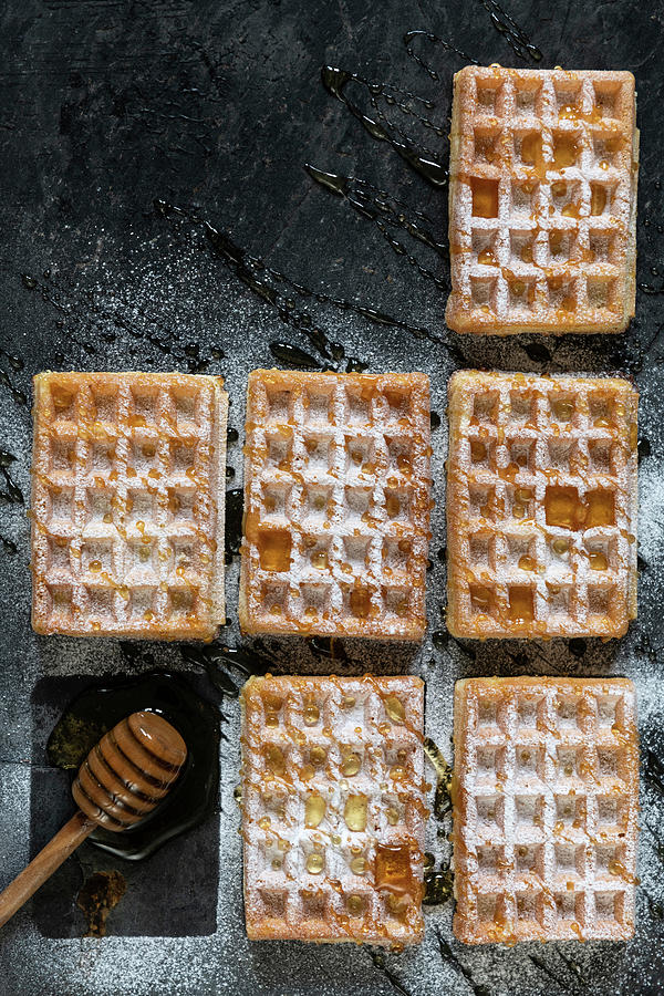 Waffles With Icing Sugard And Honey Photograph by Komar