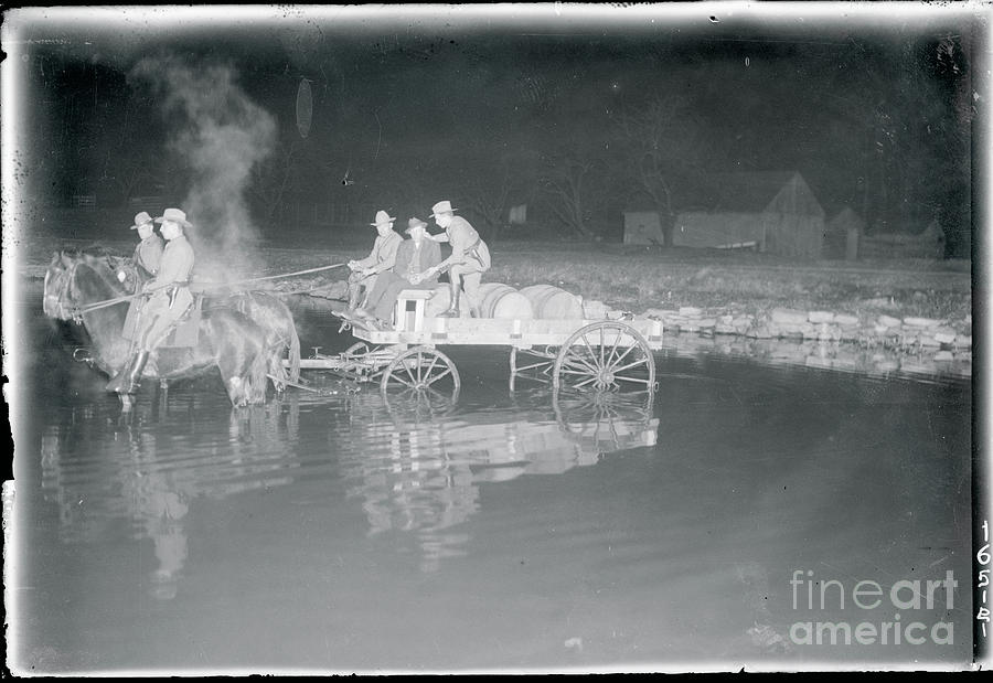 Wagon Crashing Into A River Photograph by Bettmann