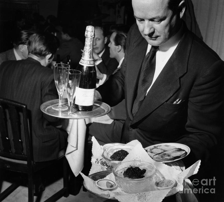 Waiter Holds Platters Of Caviar Photograph by Bettmann