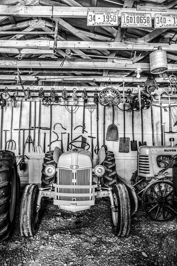Waiting in the Garage Tools and Tractors in Black and White Photograph by Debra and Dave Vanderlaan