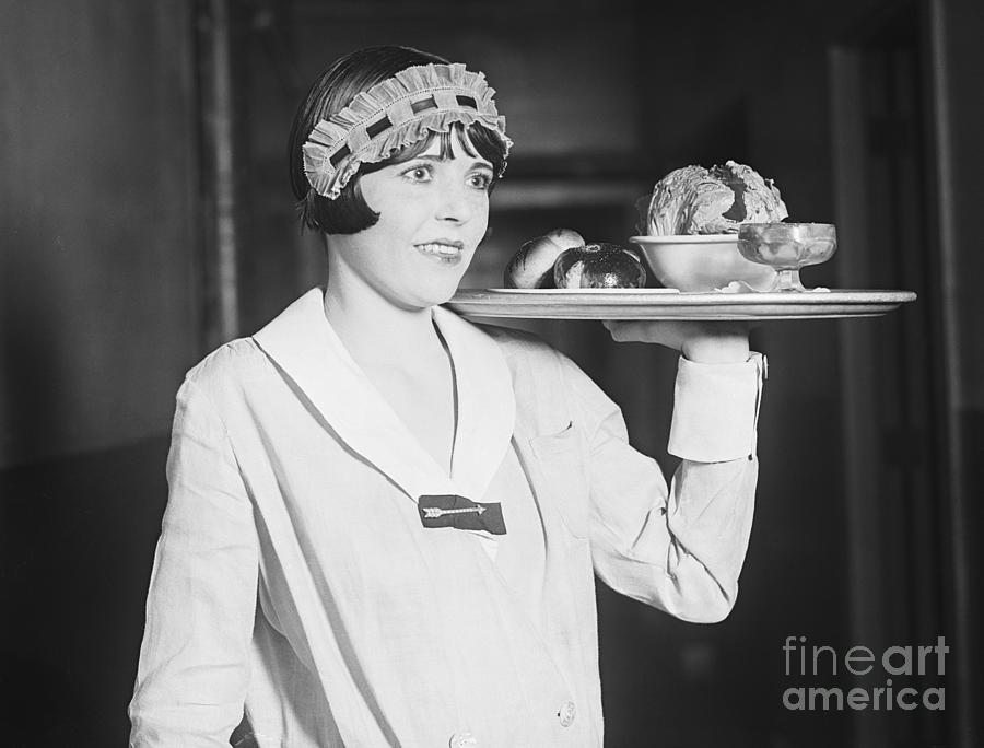Waitress Carrying Tray Photograph by Bettmann