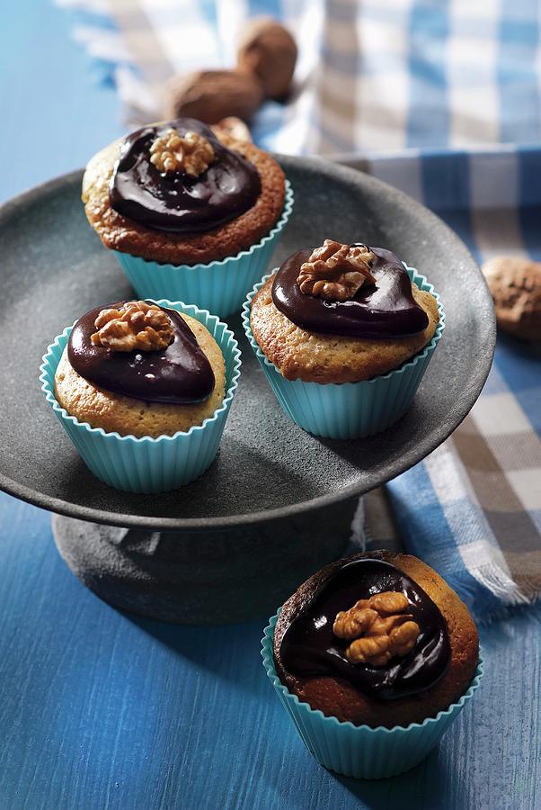 Walnut Cupcakes With Chocolate Frosting Photograph by Perrin