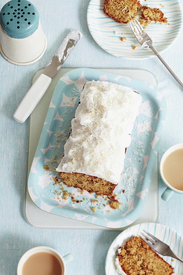 Walnut Loaf Cake With Frosting And Grated Coconut, Sliced Photograph by Charlotte Tolhurst