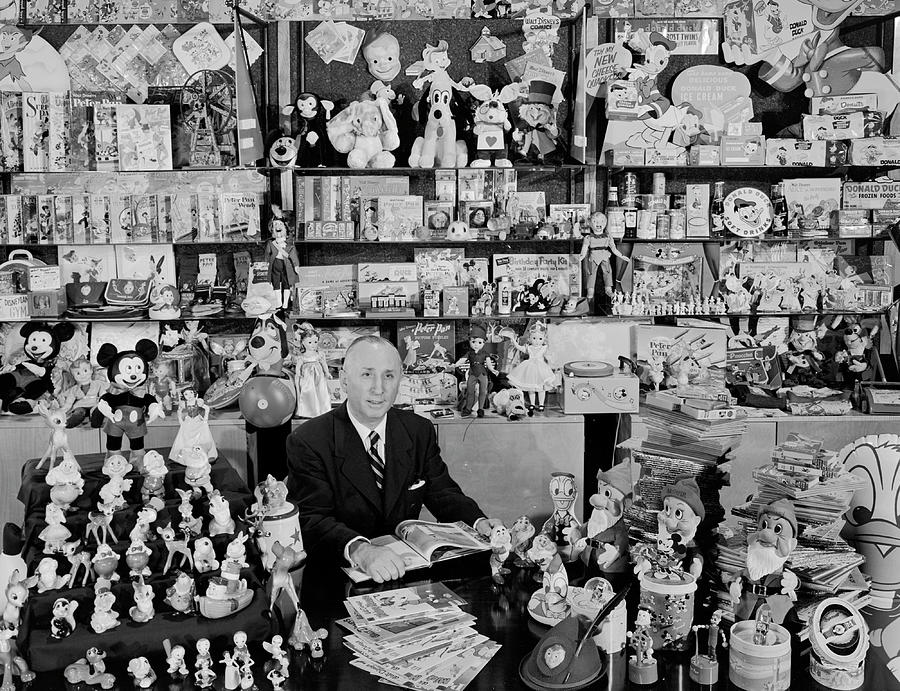 Walt Disneys brother, Roy Disney, sits proudly among some 3,000 of the 3,500 items which under his management, have been allowed to use Disney trademarks. Photograph by Alfred Eisenstaedt